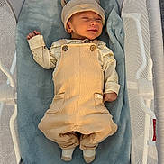 Eris joined the competition — help win amazing prizes! baby, infant, newborn, bassinet, blanket, overalls, hat, socks, smiling, eyes_closed, face, hand, cotton_clothing, mesh_side, cozy, beige_outfit, blue_blanket, top_view, nursery, tiny_feet