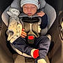 Eris is registered to the contest to win money with this photo: baby, infant, newborn, car_seat, sleeping, hat, socks, red_socks, plush_toy, stuffed_animal, blanket, harness, buckle, hand, legs, clothing, portrait, cute, cozy, seat
