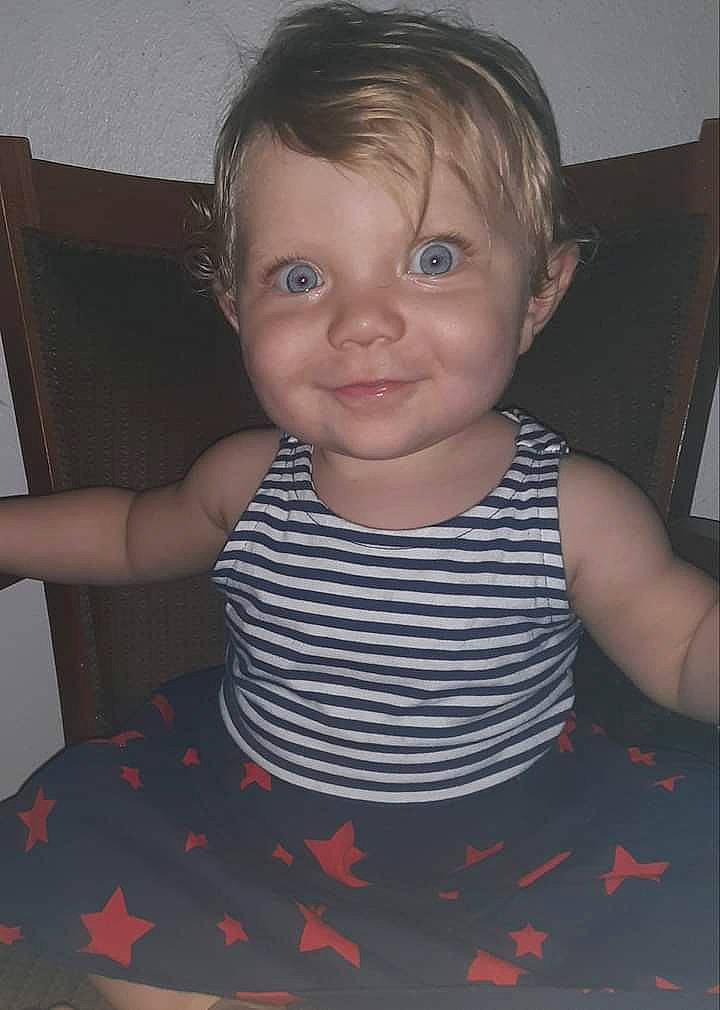 Leona is registered to the contest to win money with this photo: baby_toddler_clothing, cheek, chin, cool, dress, eye, finger, hairstyle, human_body, iris, joy, lip, mammal, mouth, neck, nose, person, shoulder, skin, sleeve