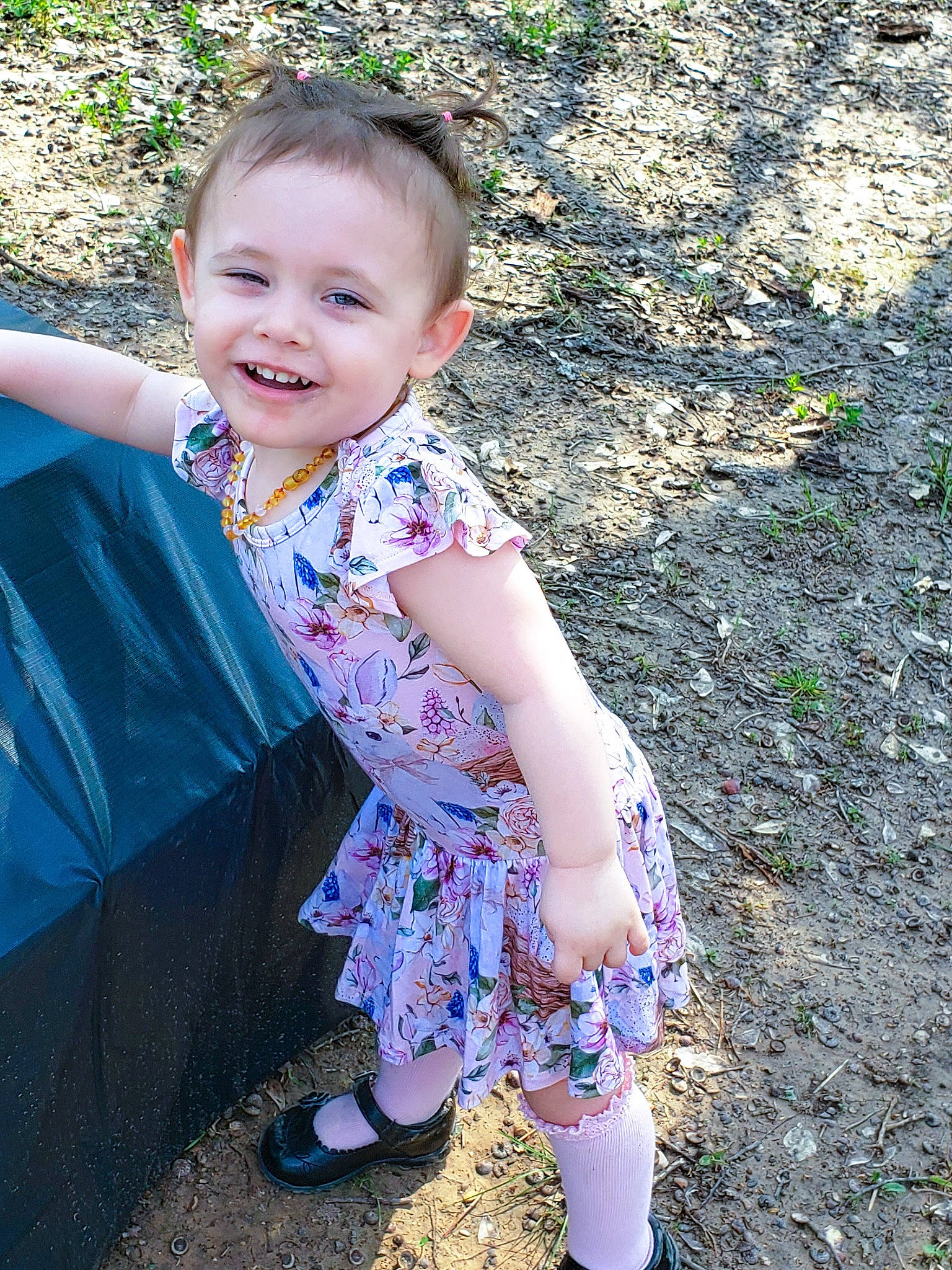 Nova joined the competition — help win amazing prizes! baby_toddler_clothing, child, fun, grass, happy, human_body, iris, joy, leg, leisure, magenta, pattern, people_in_nature, person, pink, purple, sandal, sitting, sleeve, smile