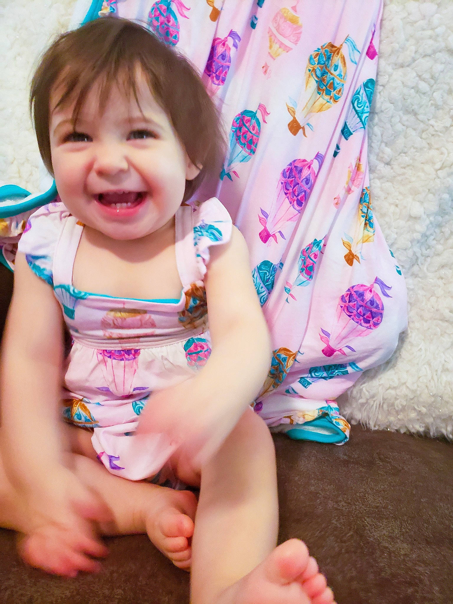 Gemma is registered to the contest to win money with this photo: baby_toddler_clothing, blue, cheek, eye, face, facial_expression, finger, fun, hairstyle, happy, joy, magenta, pattern, person, pink, product, purple, skin, sleeve, smile