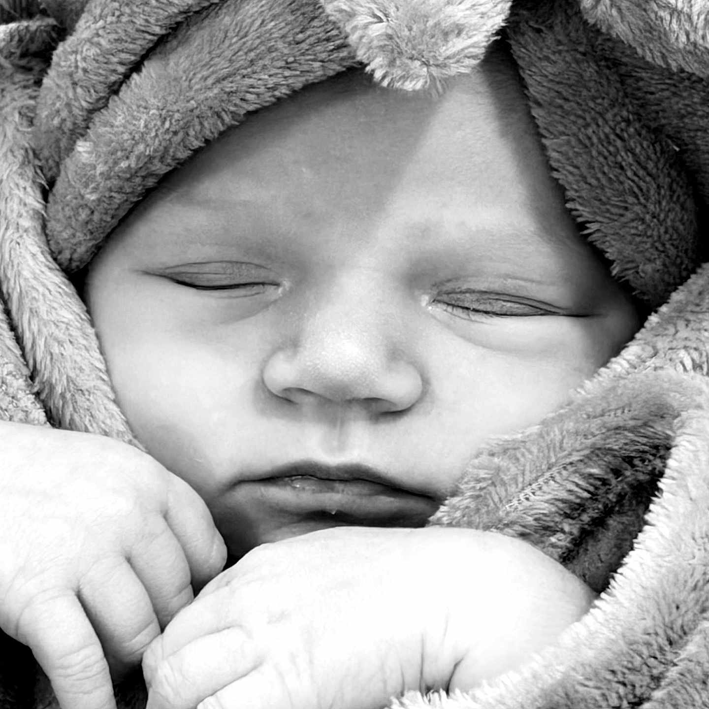 Ella is registered to the contest to win money with this photo: baby, sleeping, face, hands, blanket, soft_texture, newborn, closeup, black_and_white, peaceful, wrapped, infant, cozy, portrait, skin, cute, toddler, child, resting, warm