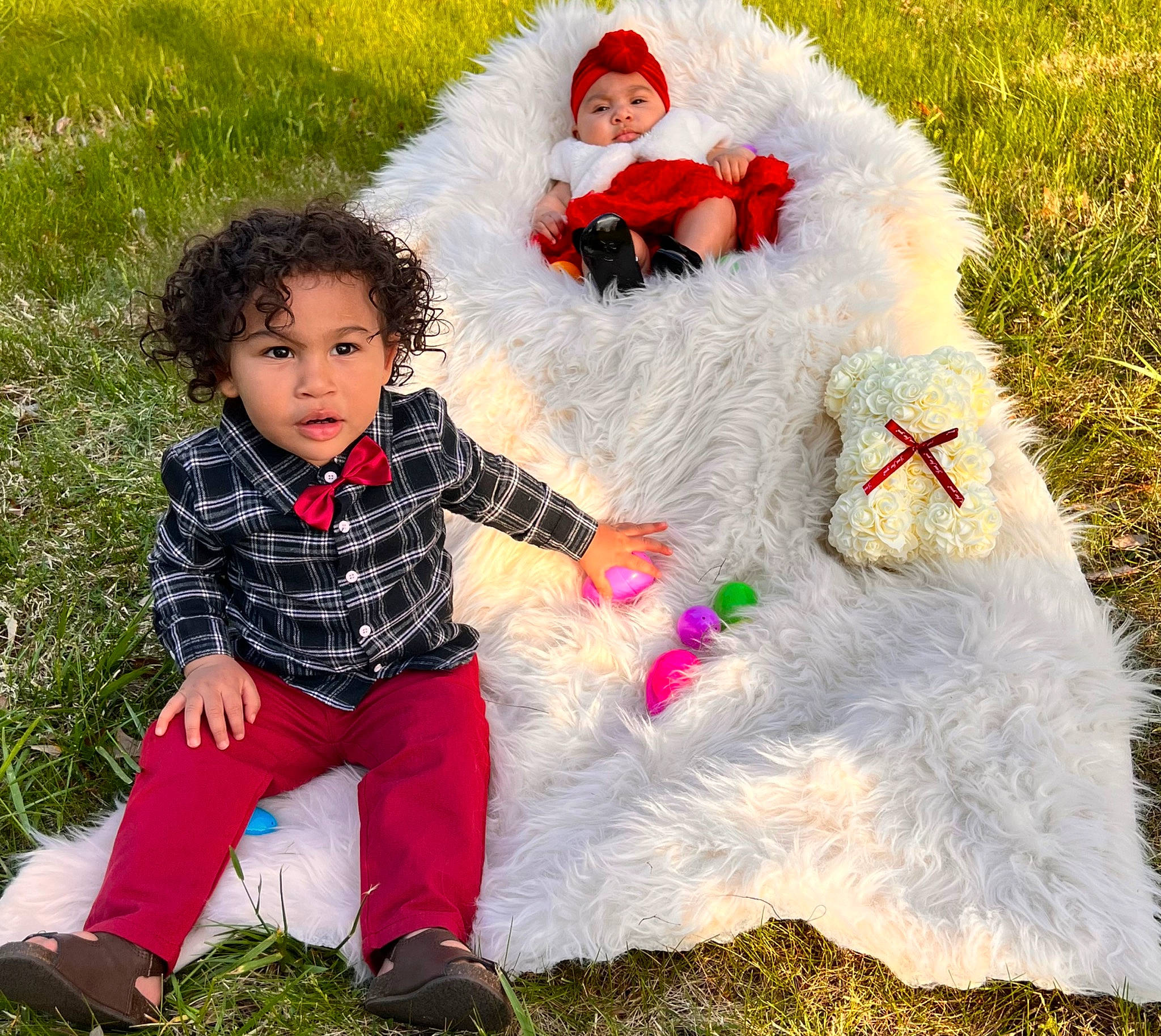 Damien is registered to the contest to win money with this photo: baby, baby_toddler_clothing, beauty, child, facial_expression, fun, grass, happy, headwear, human, interaction, lap, leisure, mammal, outerwear, people_in_nature, person, photograph, santa_claus, textile