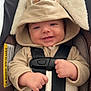 Arterix is registered to the contest to win money with this photo: baby, clothing, coat, cushion, e_scooter, face, hat, head, homedecor, hood, hoodie, jacket, knitwear, person, photography, portrait, sweater, sweatshirt, transportation, vehicle