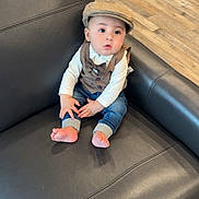 Ayden joined the competition — help win amazing prizes! baby, child, infant, portrait, sitting, couch, leather, hat, newsboy_cap, vest, bow_tie, shirt, jeans, bare_feet, indoors, living_room, wood_floor, furniture, looking_at_camera, cute