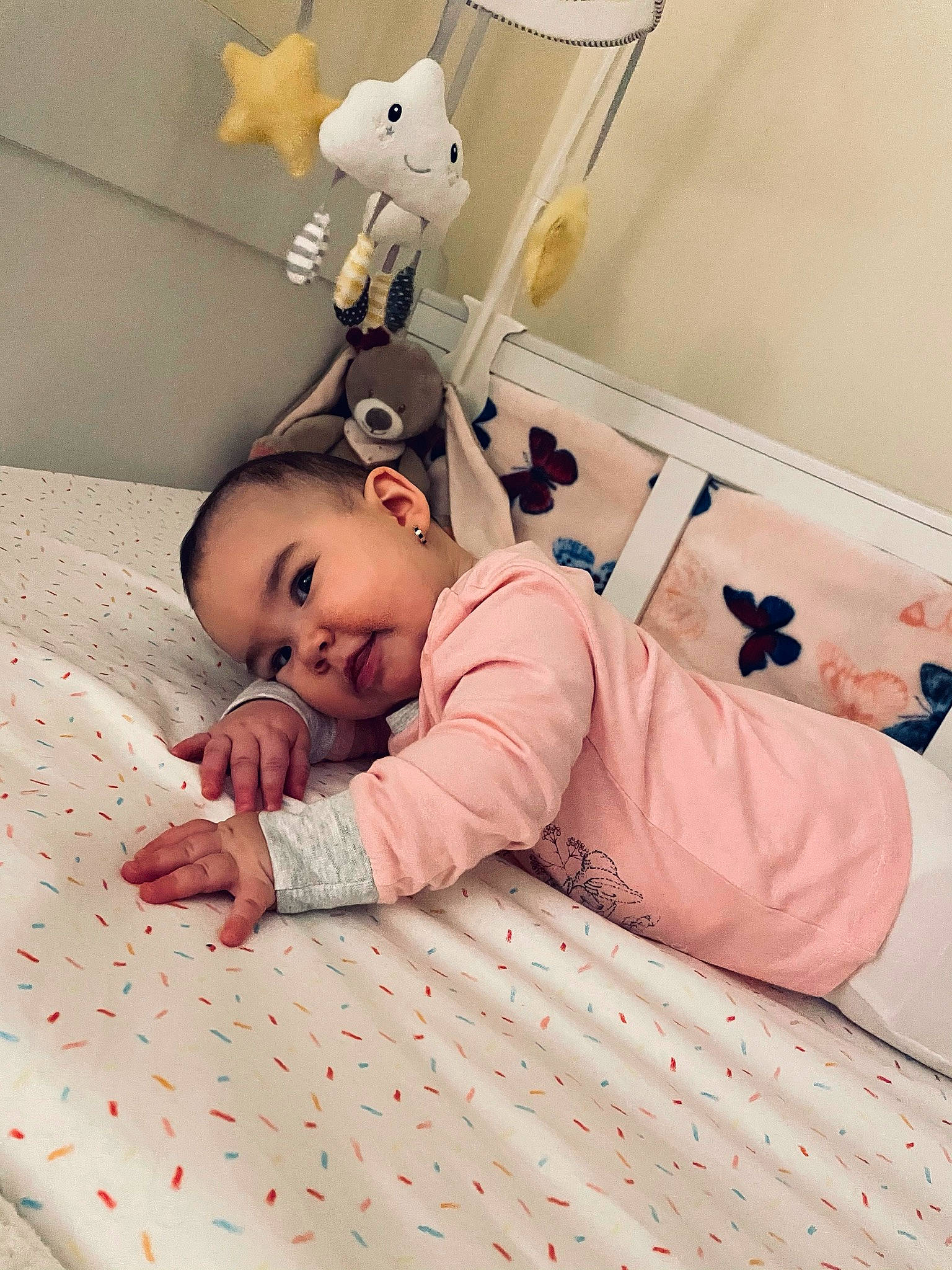 Lara joined the competition — help win amazing prizes! baby, baby_products, baby_safety, baby_toddler_clothing, bed, bed_sheet, bedding, child, comfort, flooring, happy, linens, mammal, person, pink, room, skin, smile, textile, toddler