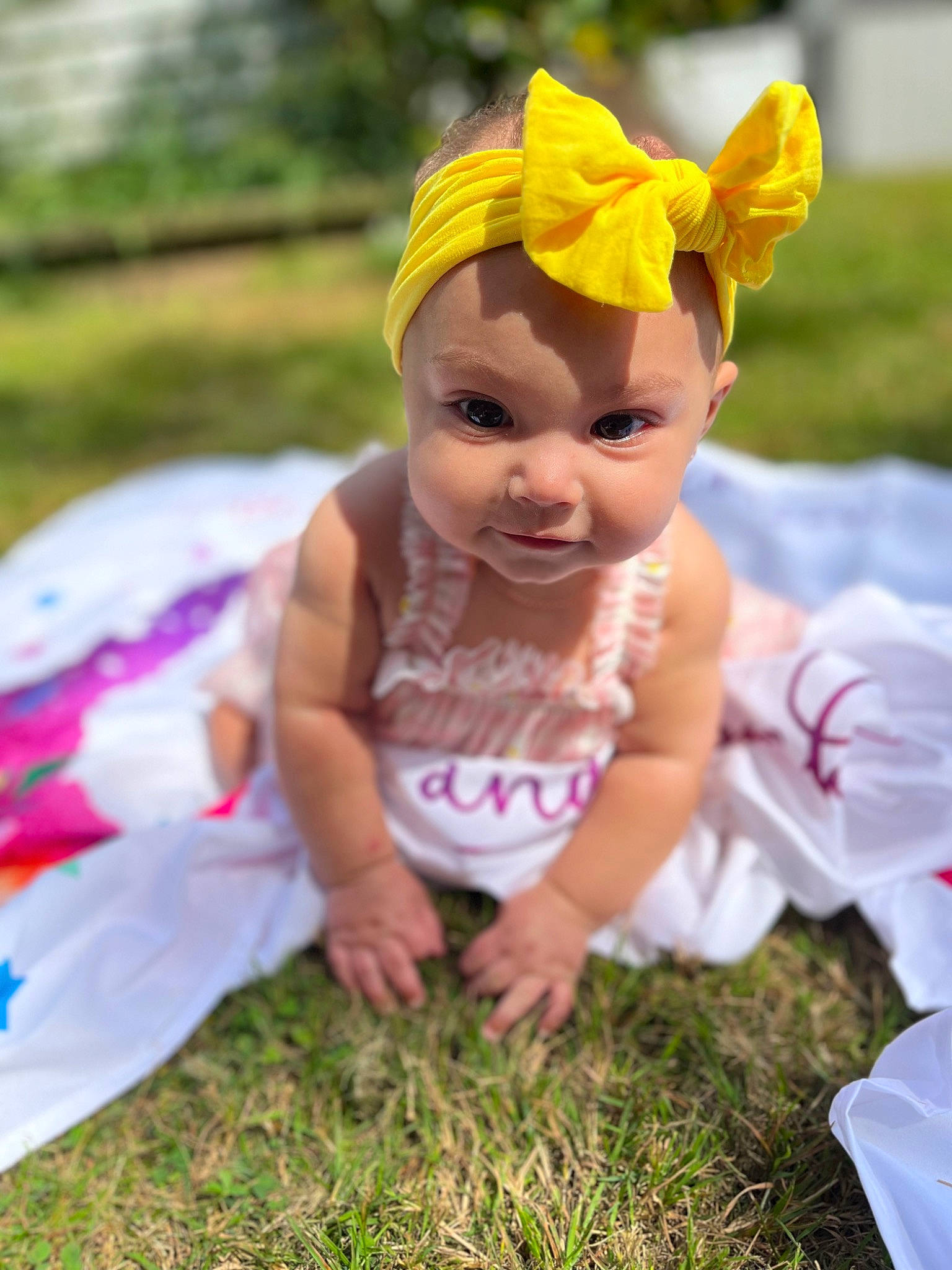 Alaina is registered to the contest to win money with this photo: child, doll, dress, eye, fawn, fun, grass, happy, headpiece, headwear, leaf, leisure, magenta, people_in_nature, person, petal, pink, plant, skin, smile