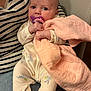 Giulyana a rejoint le concours — aidez-le/la à gagner de superbes lots ! baby, pacifier, blanket, striped_shirt, pajamas, infant, hands, face, person, sitting, comfort, indoor, closeup, cute, soft, pink, purple, jeans, adult, holding