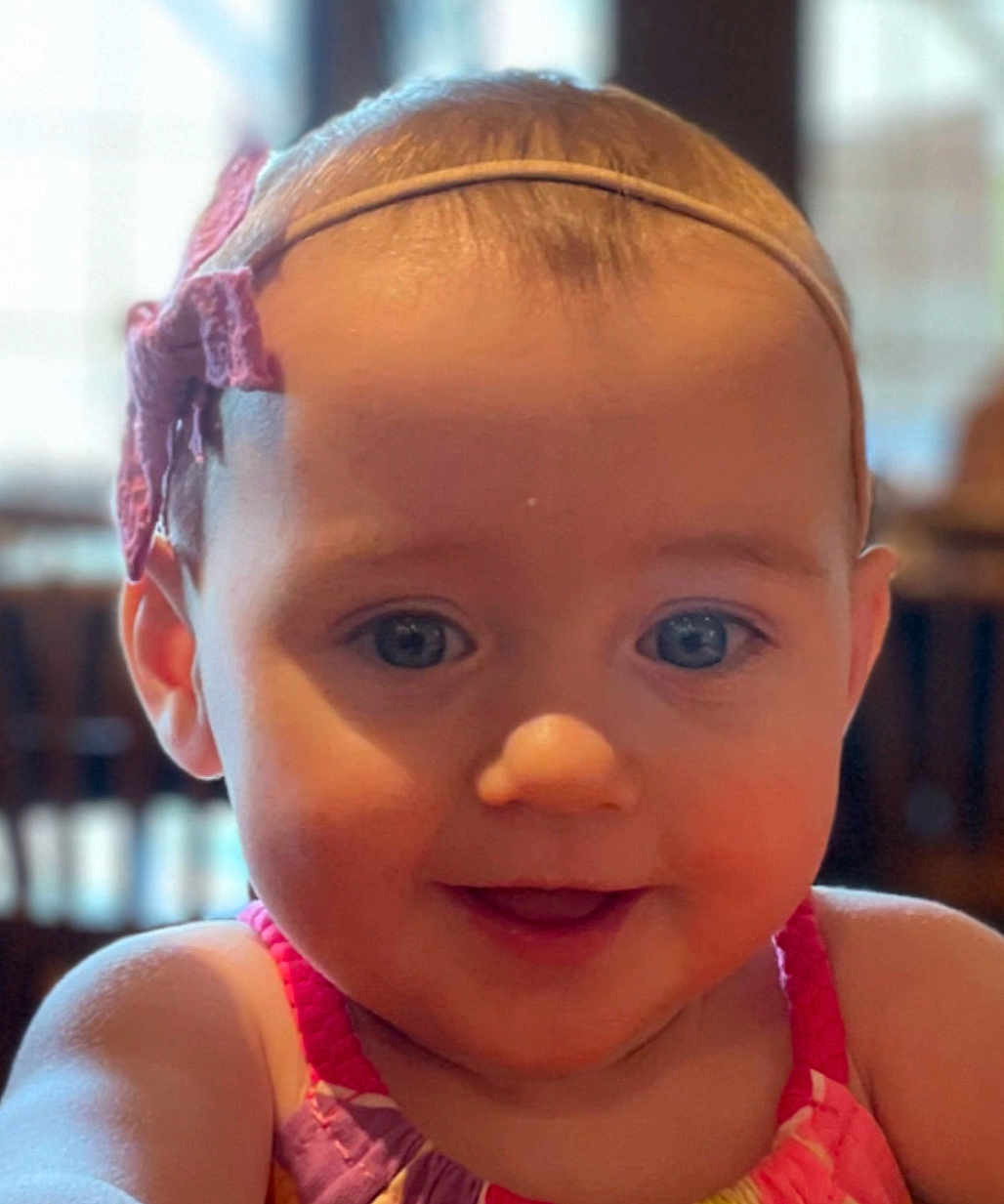Ariana is registered to the contest to win money with this photo: baby, child, smiling, face, headband, bow, dress, colorful, cute, portrait, closeup, happy, skin, eyes, infant, person, indoors, young, toddler, expression