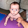 Ariana is registered to the contest to win money with this photo: baby, child, crawling, hand, adult_hand, foam_mat, blue_eyes, indoor, carpet, person, furniture, skin, closeup, focus, home, floor, support, expression, young, curious