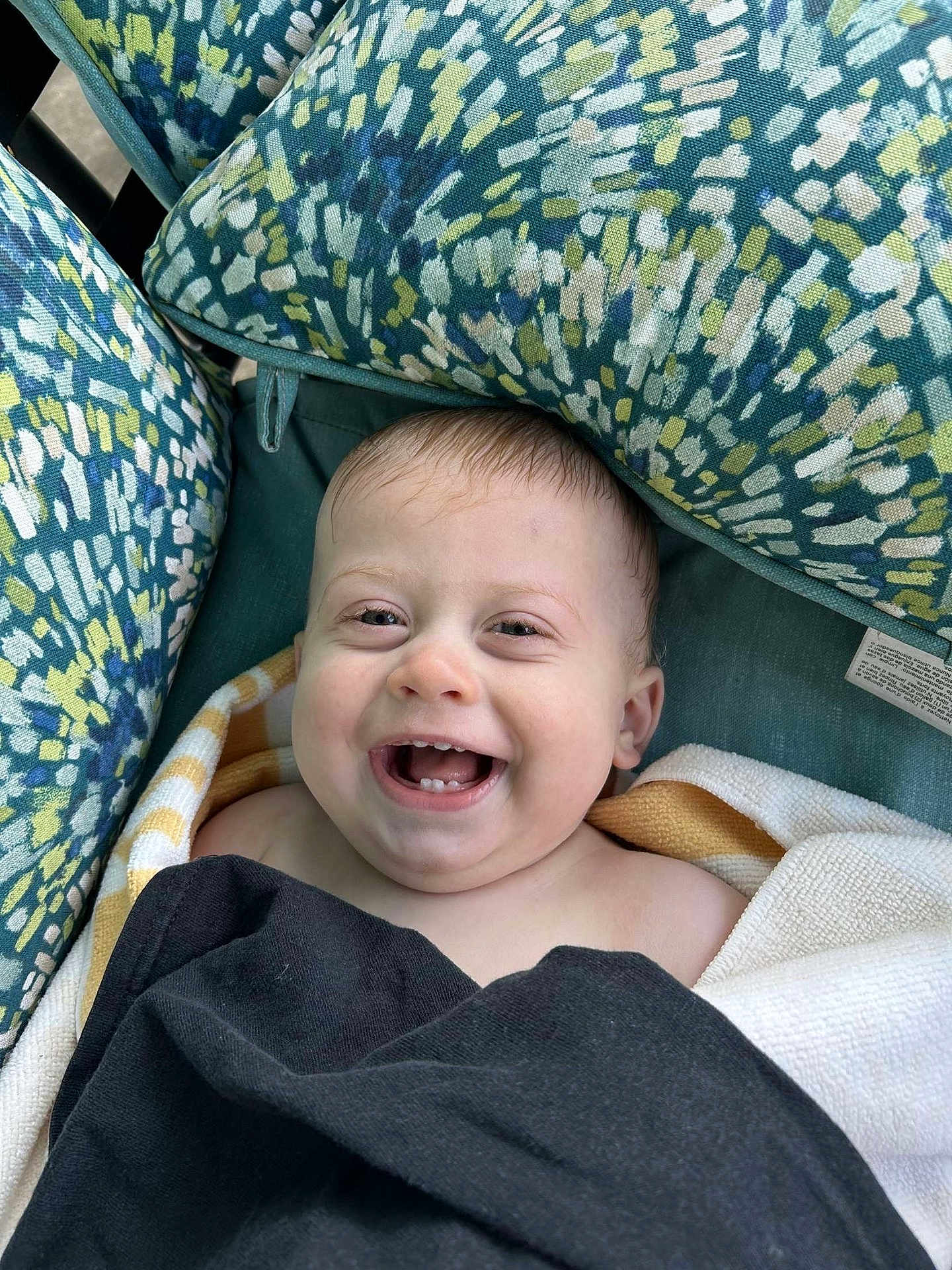 Rylan is registered to the contest to win money with this photo: baby, smiling, towel, blanket, cushion, patterned, happy, child, face, portrait, indoors, closeup, head, skin, expression, comfort, seat, infant, cheerful, young