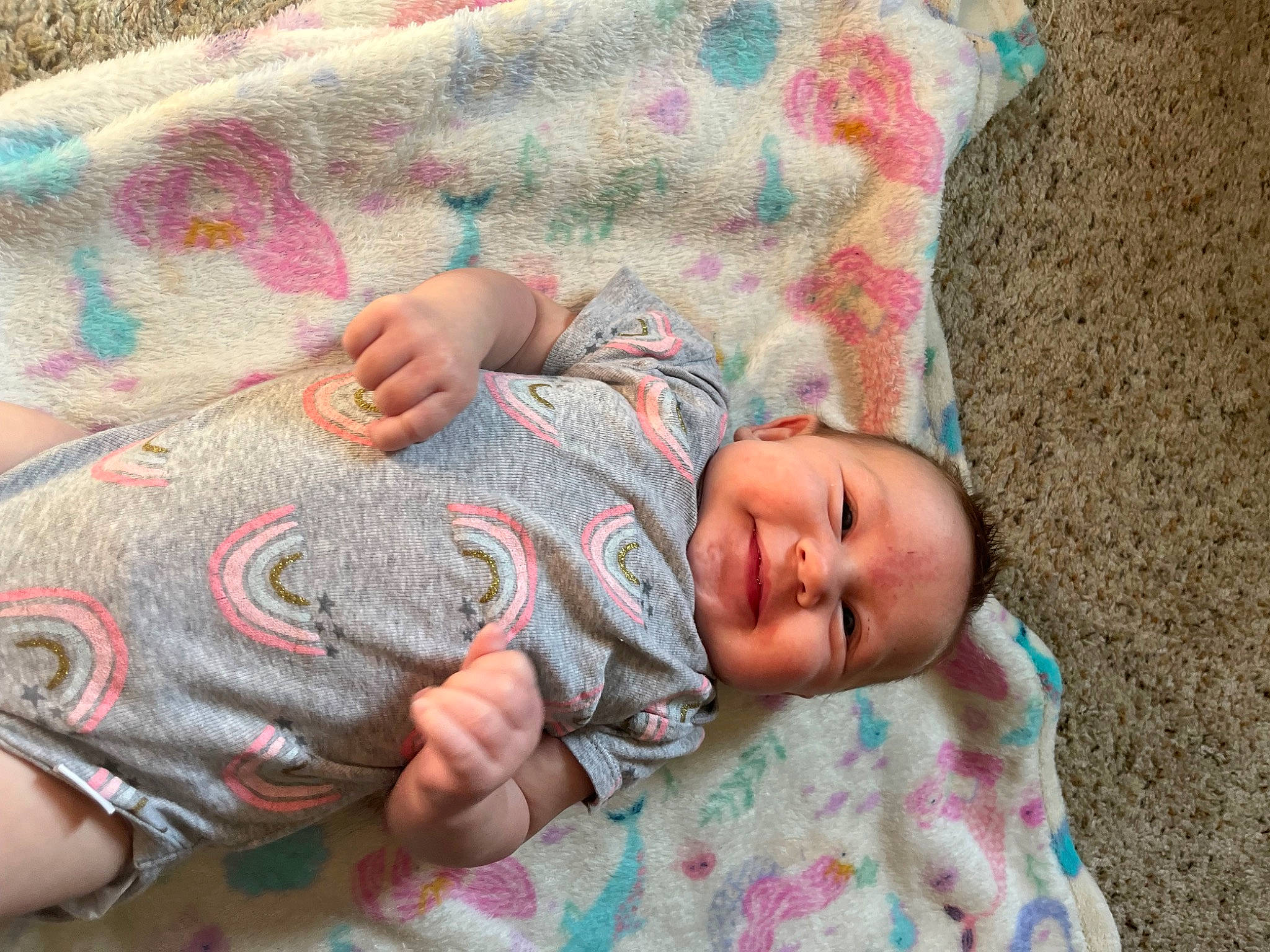 Denzleigh is registered to the contest to win money with this photo: baby, baby_toddler_clothing, bedding, bedtime, child, comfort, grass, human, linens, magenta, mammal, pattern, person, pink, skin, sleeve, t_shirt, toddler, vertebrate, wood