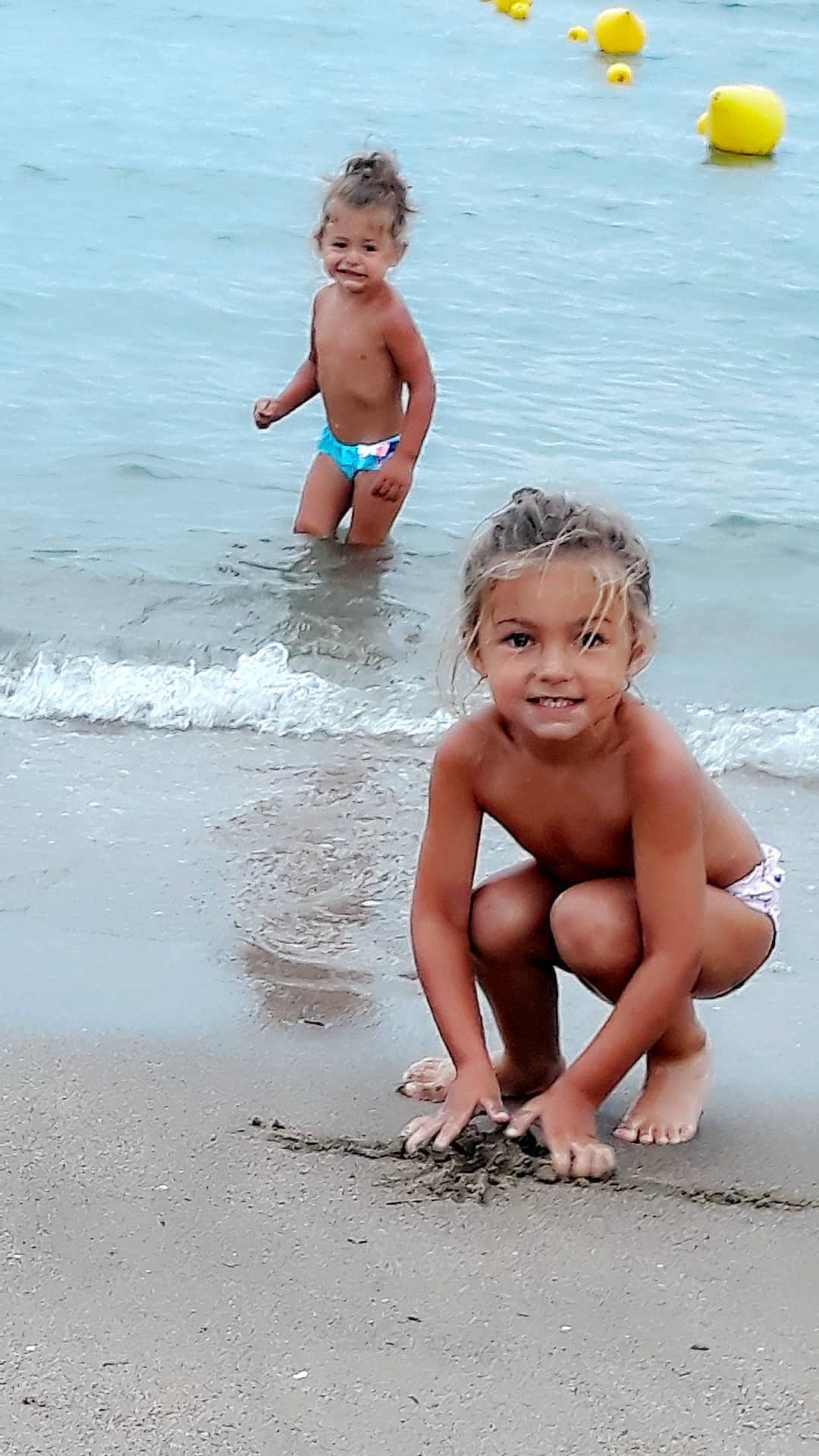 Inaya Zeina participe au concours pour gagner de l'argent avec cette photo : bathing, beach, child, fun, happy, joy, ocean, person, play, sand, sea, smile, stomach, summer, toddler, vacation