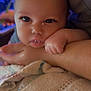 Atticus is registered to the contest to win money with this photo: baby, infant, child, face, hand, arm, blanket, closeup, cute, eyes, eyelashes, heart, resting, soft, blurred_background, indoor, person, skin, expression, toddler