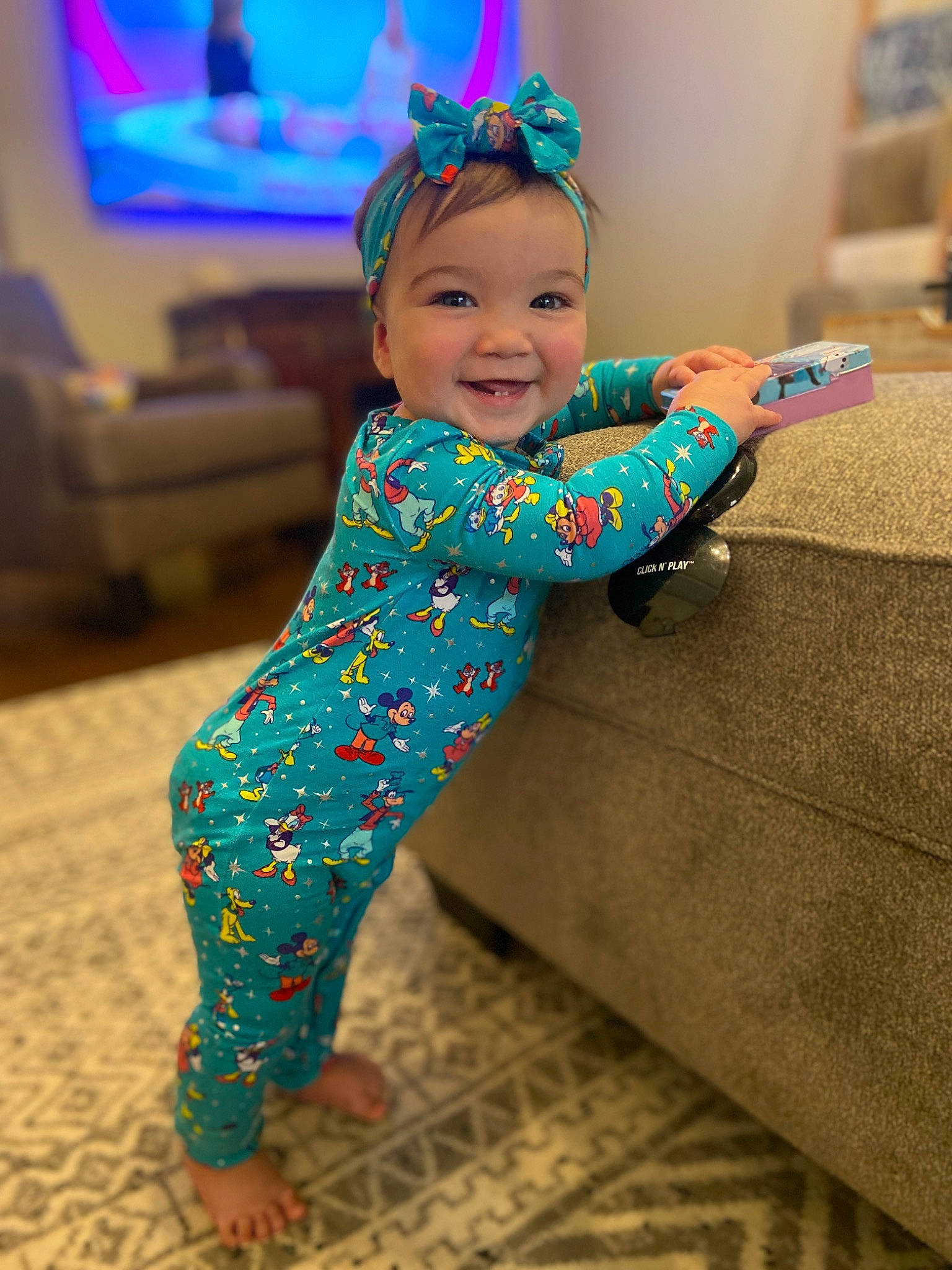Sadie joined the competition — help win amazing prizes! baby, baby_toddler_clothing, barefoot, child, floor, flooring, foot, fun, happy, human_leg, joy, leisure, magenta, pattern, person, purple, room, sitting, sleeve, smile