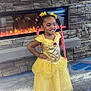 Miamor joined the competition — help win amazing prizes! child, girl, princess_dress, yellow_dress, braided_hair, pink_hair, bows, fireplace, stone_wall, carpet, smiling, standing, indoor, happy, cute, portrait, fashion, costume, playful, confident
