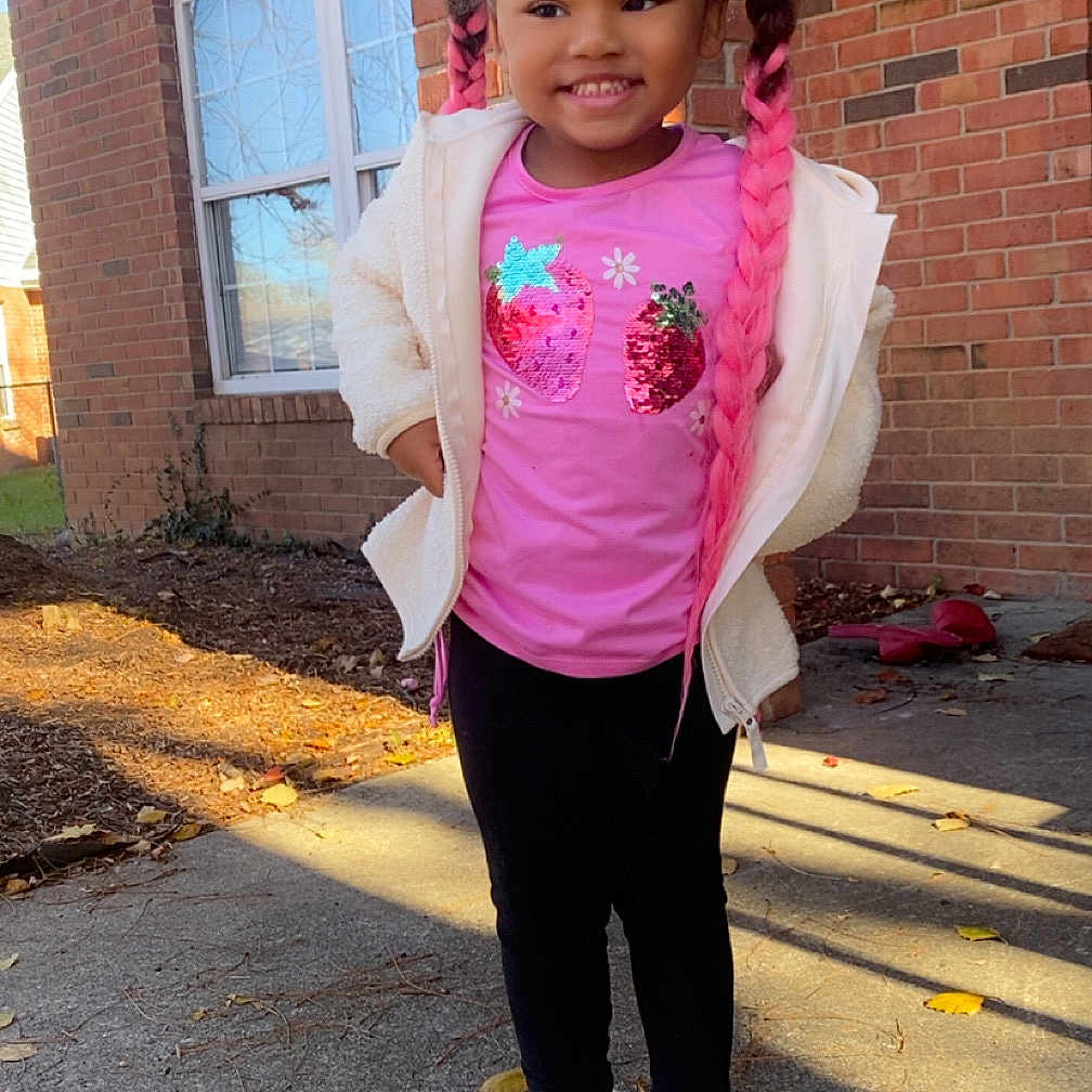 Miamor joined the competition — help win amazing prizes! child, girl, pink_hair, braids, pink_shirt, sequins, jacket, slippers, outdoor, brick_building, sidewalk, sunlight, autumn, leaves, smiling, standing, happy, casual_clothing, young_child, daylight