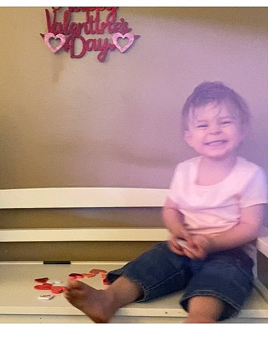 Dredyn is registered to the contest to win money with this photo: barefoot, child, flash_photography, flooring, font, foot, fun, gesture, happy, human_leg, joy, knee, magenta, person, room, shorts, sitting, sleeve, smile, t_shirt