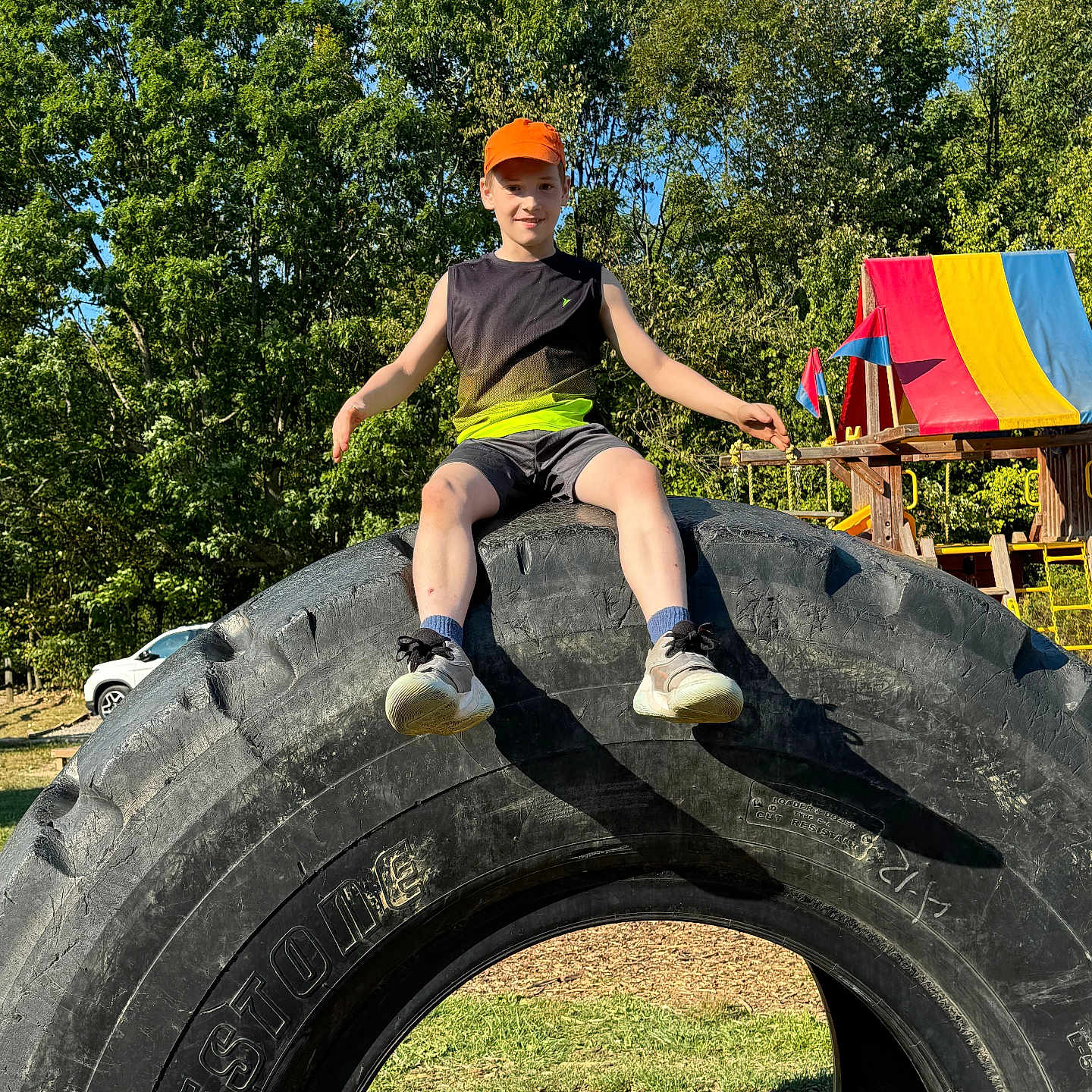 Mason is registered to the contest to win money with this photo: alloywheel, animal, bird, boy, car, carwheel, child, clothing, footwear, machine, male, outdoors, person, playarea, shoe, spoke, tire, transportation, vehicle, wheel