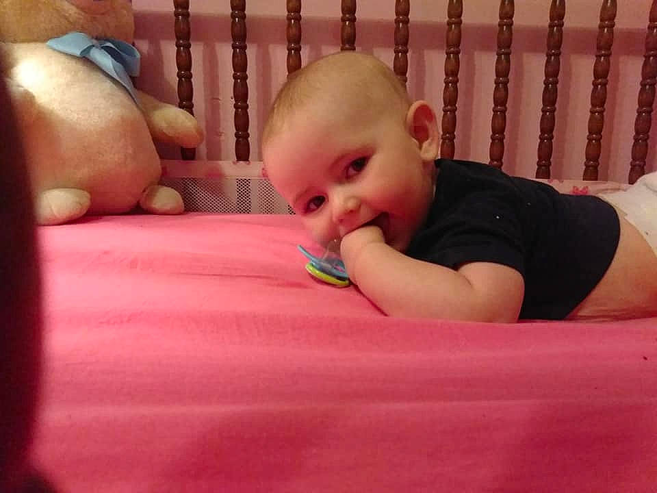 Addison is registered to the contest to win money with this photo: arm, baby, beauty, bed, cheek, child, eye, face, finger, hand, head, leg, lip, mouth, nose, person, pink, product, skin, toddler