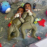 Kai'Ir And Kaidin joined the competition — help win amazing prizes! twins, baby, infant, onesie, toy, plush_toy, pop_it_toy, building_blocks, blanket, floor, child, playtime, cute, lying_down, indoor, patterned_blanket, colorful, chewing_toy, matching_outfits, happy