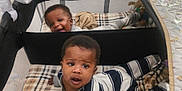 Kai'Ir And Kaidin joined the competition — help win amazing prizes! baby, blanket, child, comfort, curious, earrings, fabric, face, happy, home, indoor, infant, pajamas, person, playpen, resting, smiling, soft, striped_clothing, toys