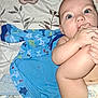 baby, infant, foot, hand, blue_blanket, shark_pattern, bedspread, floral_pattern, diaper, skin, face, eyes, cute, lying_down, indoors, child, curious, sucking, blanket, baby_clothing