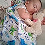baby, sleeping, blanket, dinosaur, plush_toy, bunny, child, cute, cozy, rest, peaceful, indoor, soft_toy, infant, toddler, comfort, fabric, pattern, face, nap