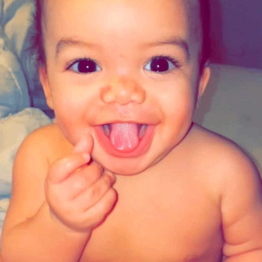 Dayvion joined the competition — help win amazing prizes! baby, child, chubby, cute, diaper, eyes, face, hand, happy, indoors, infant, mouth, person, portrait, sitting, skin, smiling, soft_lighting, tongue_out, young