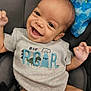 baby, smiling, car_seat, onesie, infant, happy, child, blue_blanket, clothing, portrait, cute, seatbelt, indoor, young_child, graco, dinosaur, baby_girl, baby_boy, infancy, expression
