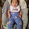 Raelynn joined the competition — help win amazing prizes! baby, infant, child, bib, baby_rocker, blue_clothing, floral_pattern, socks, face, expression, furniture, wood_floor, indoor, person, cute, seated, home, new_to_the_crew, curious, casual