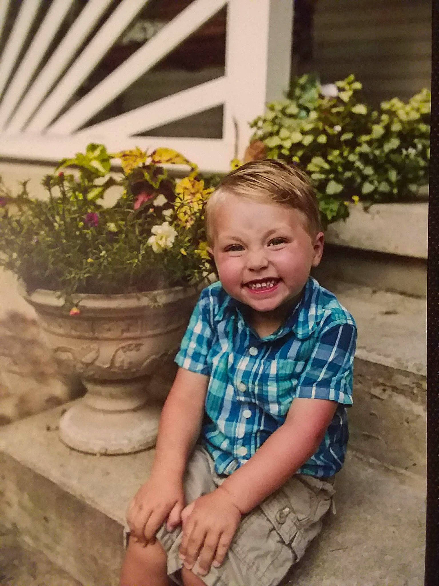 Aiden joined the competition — help win amazing prizes! child, eye, face, facial_expression, fun, garden, grass, happy, head, joy, people, person, photograph, photography, plant, sitting, skin, smile, summer, toddler