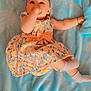 baby, child, tiara, dress, floral, blanket, blue, socks, lying_down, thumb_sucking, cute, infant, bracelet, floor, wooden_floor, colorful, sparkly, soft, portrait, indoors