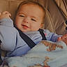 Aurora is registered to the contest to win money with this photo: baby, infant, child, smiling, tongue_out, portrait, car_seat, seatbelt, blanket, cozy, indoor, vehicle, sitting, looking_at_camera, light_blue_clothing, brown_hair, face, happy, candid, close_up