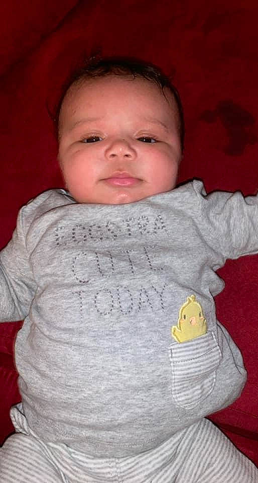 Khari joined the competition — help win amazing prizes! baby, baby_toddler_clothing, cheek, child, chin, comfort, facial_expression, happy, lip, mouth, neck, nose, outerwear, pattern, person, pink, skin, sleeve, smile, t_shirt