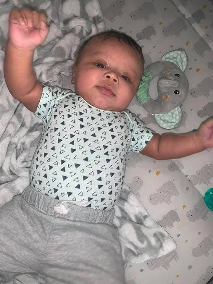 Khari is registered to the contest to win money with this photo: adaptation, baby, baby_toddler_clothing, comfort, facial_expression, finger, fun, gesture, hand, head, human_body, joint, mammal, mouth, nose, person, pink, skin, sleeve, textile