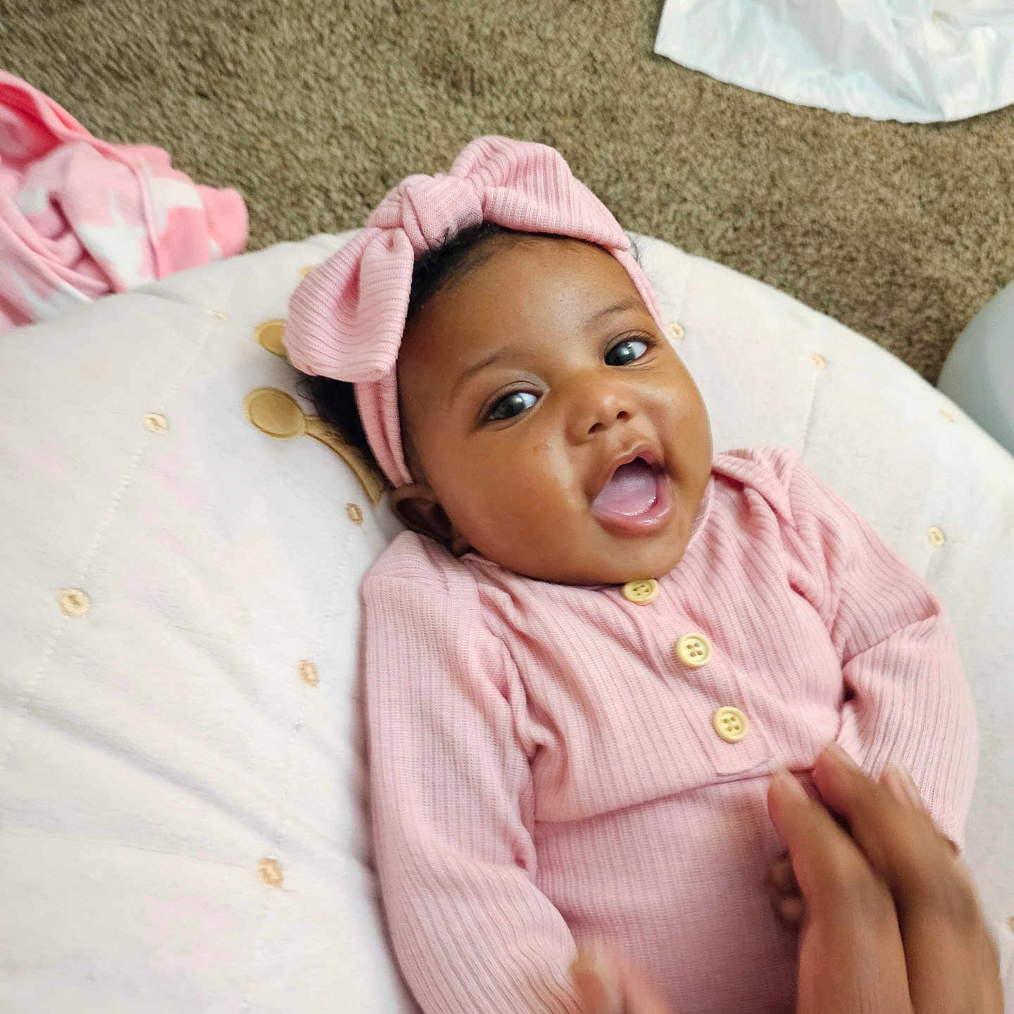 Trinity is registered to the contest to win money with this photo: baby, babylaughing, bed, bodypart, bonnet, cap, clothing, face, finger, furniture, hand, happy, hat, head, laughing, newborn, person, photography, portrait, smile