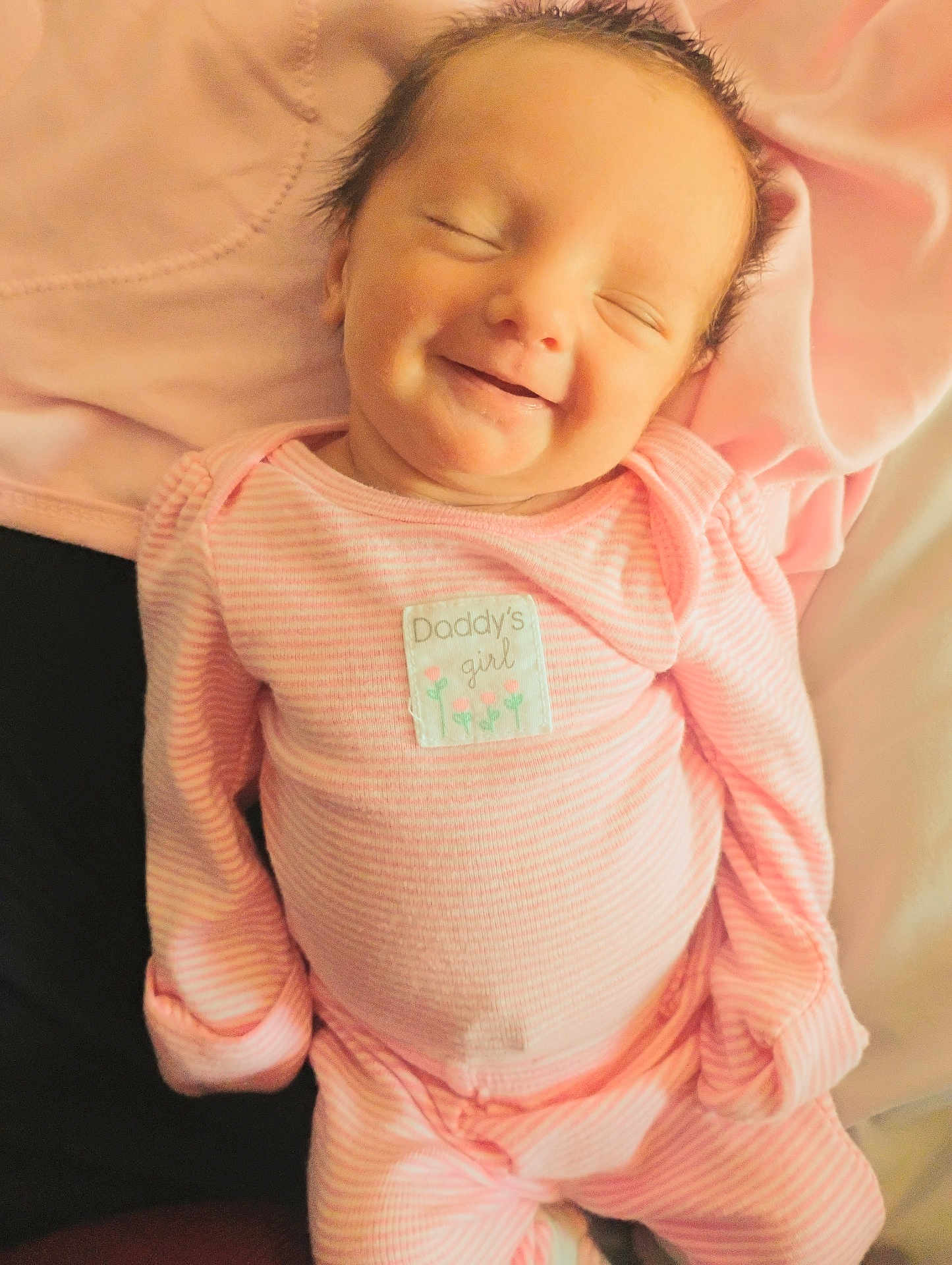 Kylie joined the competition — help win amazing prizes! baby, child, smiling, pink_clothing, infant, sleeping, cute, face, newborn, soft_blanket, lying_down, portrait, happiness, cozy, indoor, baby_girl, small_hands, peaceful, adorable, striped_clothing
