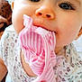 Elena a rejoint le concours — aidez-le/la à gagner de superbes lots ! baby, child, face, blue_eyes, clothing, pink_stripes, floral_pattern, mouth, chewing, close_up, infant, cute, soft_focus, person, young_child, fabric, apparel, indoor, skin, head