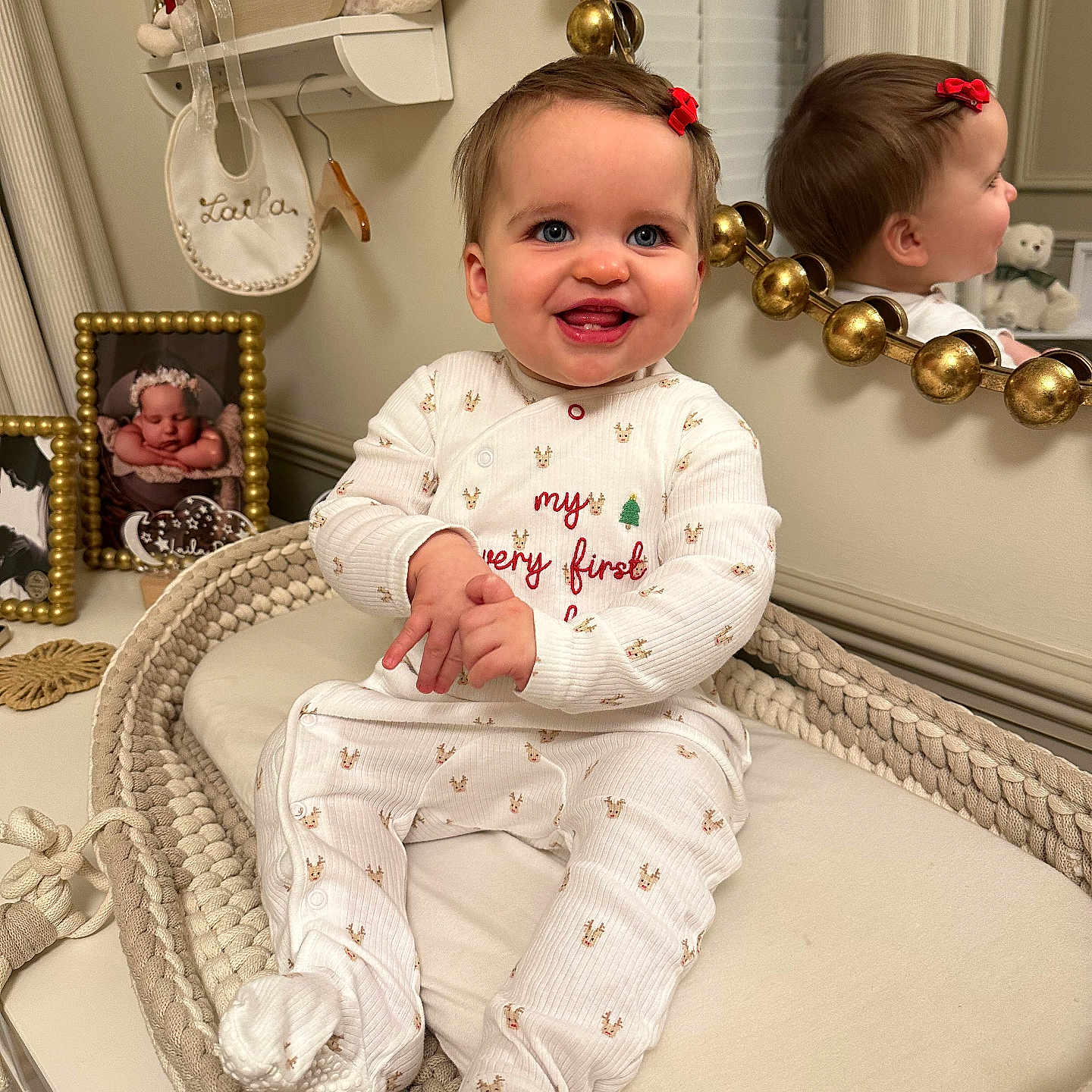 Laila Rose joined the competition — help win amazing prizes! baby, bow, child, crib, cushion, cute, decor, face, frame, happy, indoor, infant, mirror, nursery, person, photograph, red_bow, reflection, smiling, white_pajamas