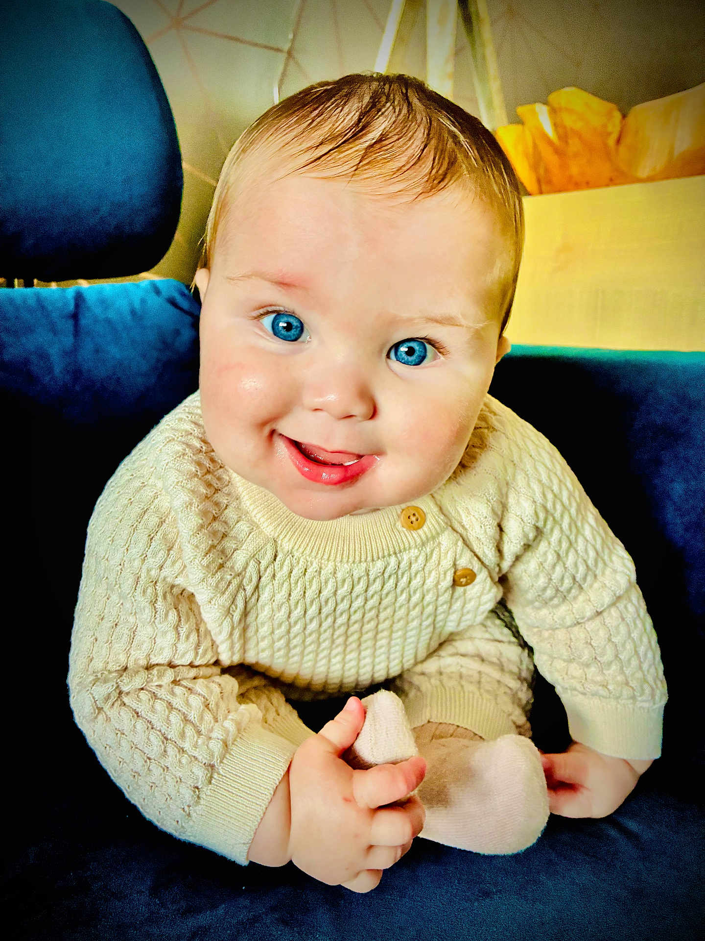 Walter joined the competition — help win amazing prizes! baby, blue_eyes, smile, knit_sweater, cozy, sock, hand, chair, plush, cute, portrait, infant, child, indoor, happy, candid, person, young, seated, warm