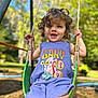 toddler, child, swing, outdoor, playground, curly_hair, purple_outfit, cartoon_snail, gary, smiling, sunlight, greenery, summer, happy, daylight, rope, fun, park, person, nature