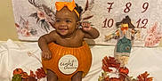 Kaiser joined the competition — help win amazing prizes! baby, pumpkin, orange_bow, autumn_leaves, fall_decor, smiling, eight_months, calendar, scarecrow, decorative_pumpkins, infant, holiday_theme, cute, sitting, indoors, celebration, festive, child, portrait, seasonal