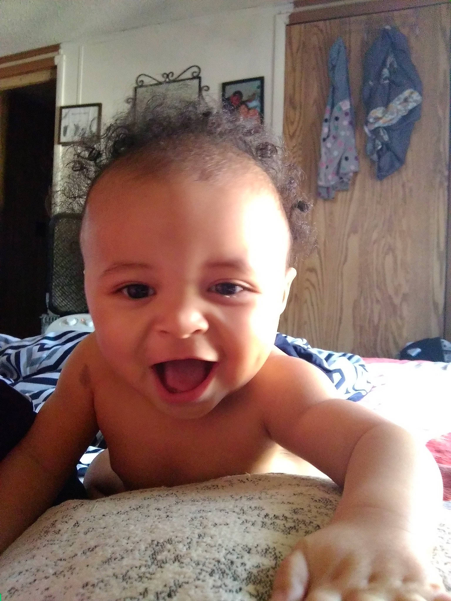 Kodie is registered to the contest to win money with this photo: boy, cheek, child, chin, day, eyebrow, face, facial_expression, finger, forehead, hair, hairstyle, head, human_hair_color, infant, lip, mouth, nose, person, skin