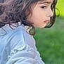 Sajal is registered to the contest to win money with this photo: child, curly_hair, profile, white_clothing, outdoor, green_background, soft_focus, portrait, young, side_view, casual, natural_light, serene, cute, face, person, skin, thoughtful, fashion, closeup