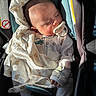 Agustin is registered to the contest to win money with this photo: baby, blanket, car_seat, child, clothing, cozy, cute, face, hand, head, indoor, infant, napping, pacifier, peaceful, rest, seatbelt, sleeping, soft_toy_pattern, sunlight