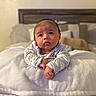 Agustin joined the competition — help win amazing prizes! baby, infant, pillow, blanket, bedroom, bed, headboard, clothing, sleepwear, child, cute, indoors, portrait, soft, cozy, expression, resting, young, face, person