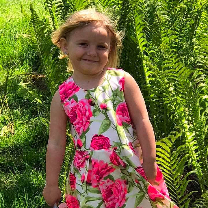 Lacy is registered to the contest to win money with this photo: botany, child, day_dress, dress, flower, grass, grass_family, joy, pattern, person, pink, plant, shrub, summer, terrestrial_plant, toddler, wildflower