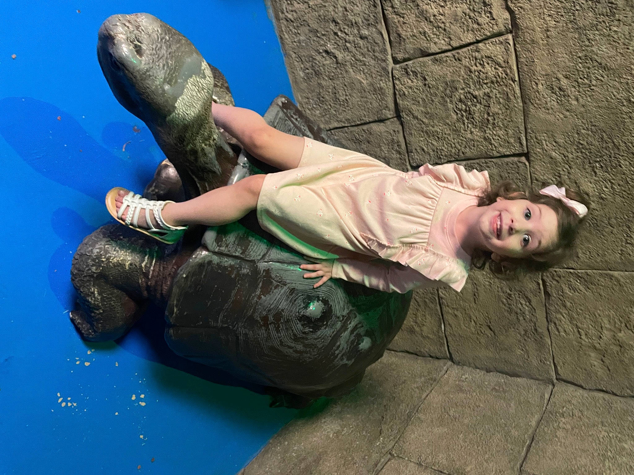 Aryah joined the competition — help win amazing prizes! arm, art, brick, child, elbow, flash_photography, foot, fun, grass, happy, human_body, human_leg, joy, leg, leisure, person, recreation, rock, sandal, sitting