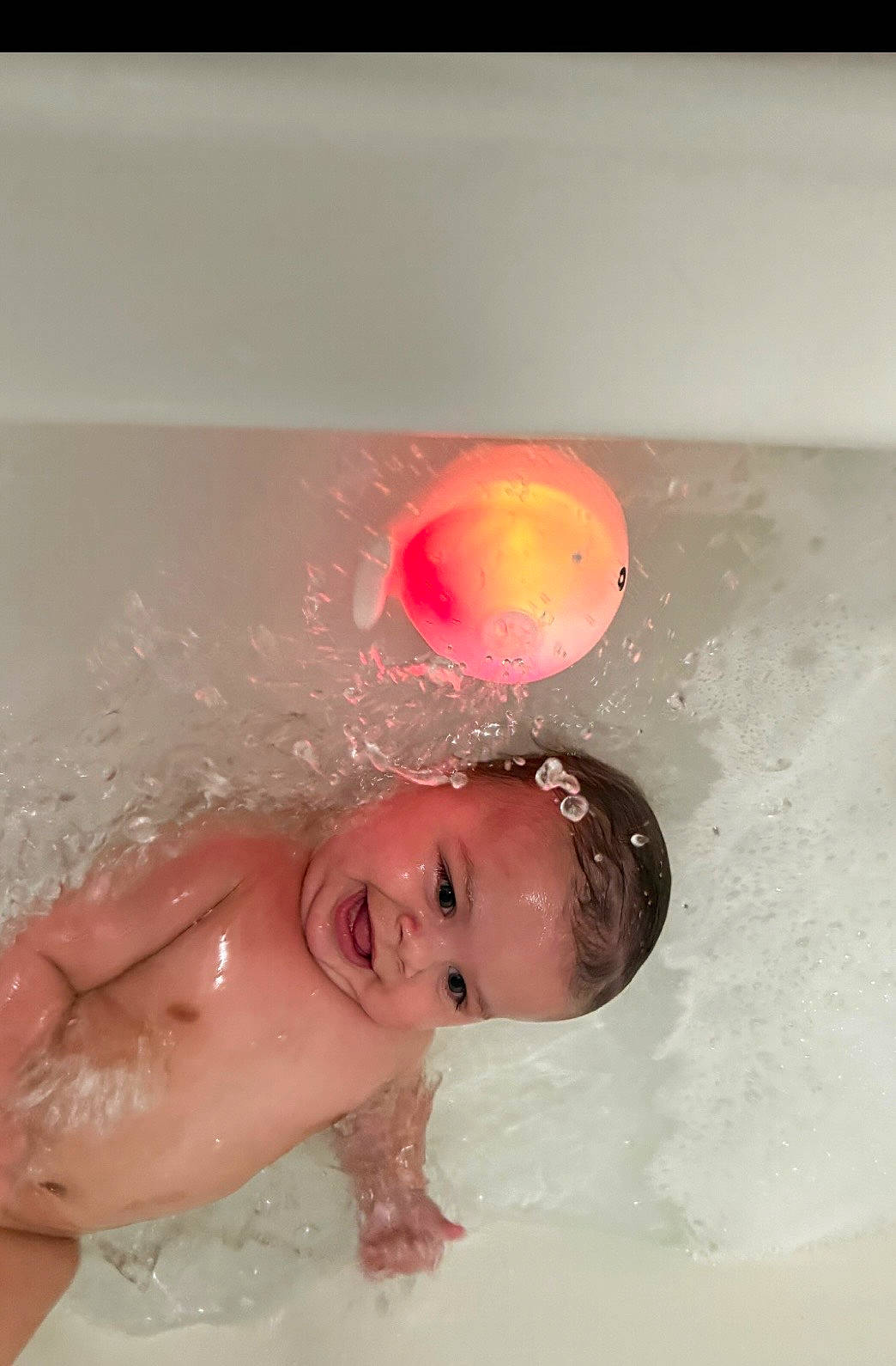 Xzhavien is registered to the contest to win money with this photo: baby, bath, bathtub, bubble, child, cute, floating, fun, glowing, happy, infant, joy, playing, skin, smile, splash, splashing, toy, water, wet